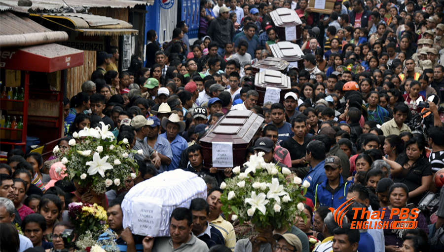 Residents carry the coffins of 7 people who died following the eruption of the Fuego volcano in San Miguel Los Lotes