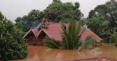 Relief aid pours in for Laos as search for missing continues