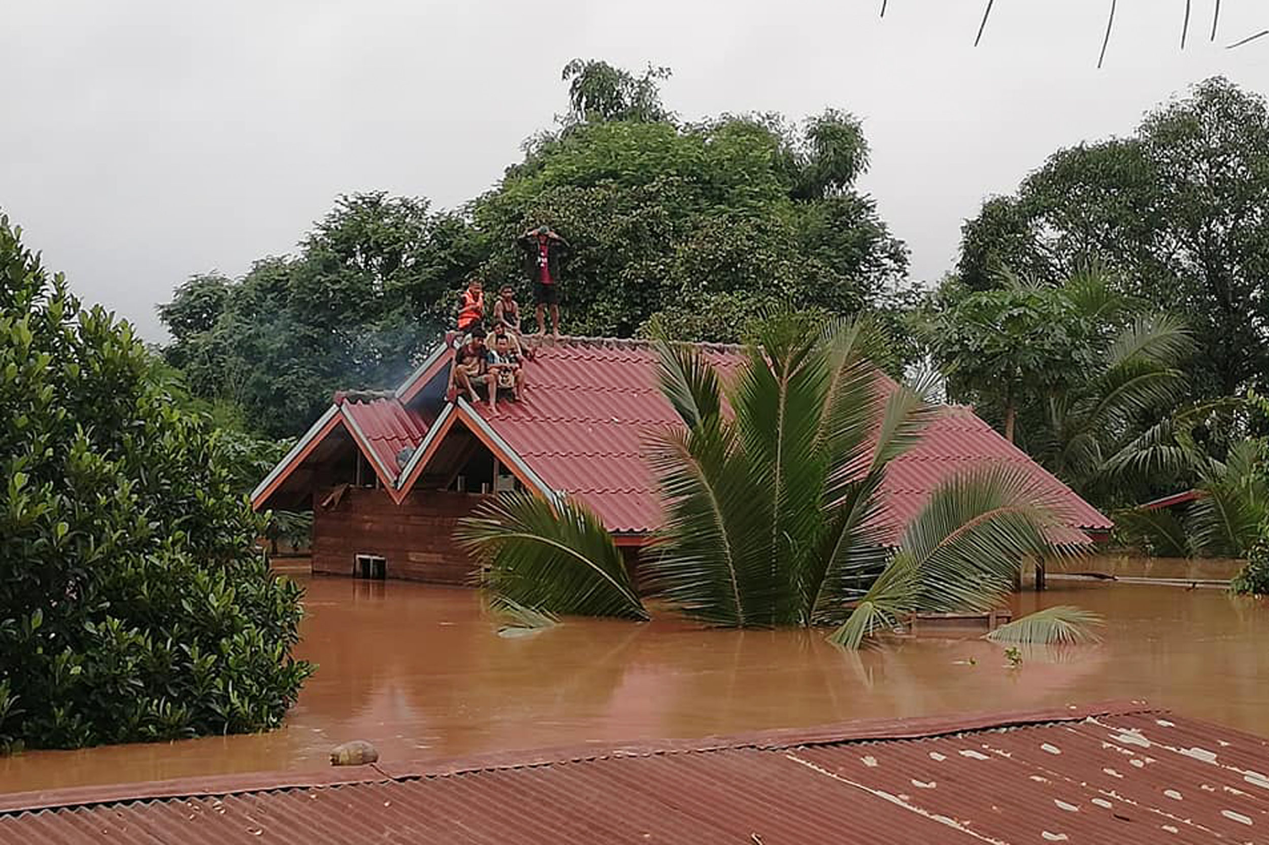 Relief aid pours in for Laos as search for missing continues