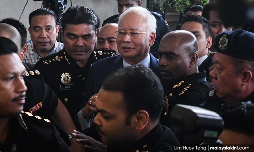 Ex-PM Najib taken to court to face charges