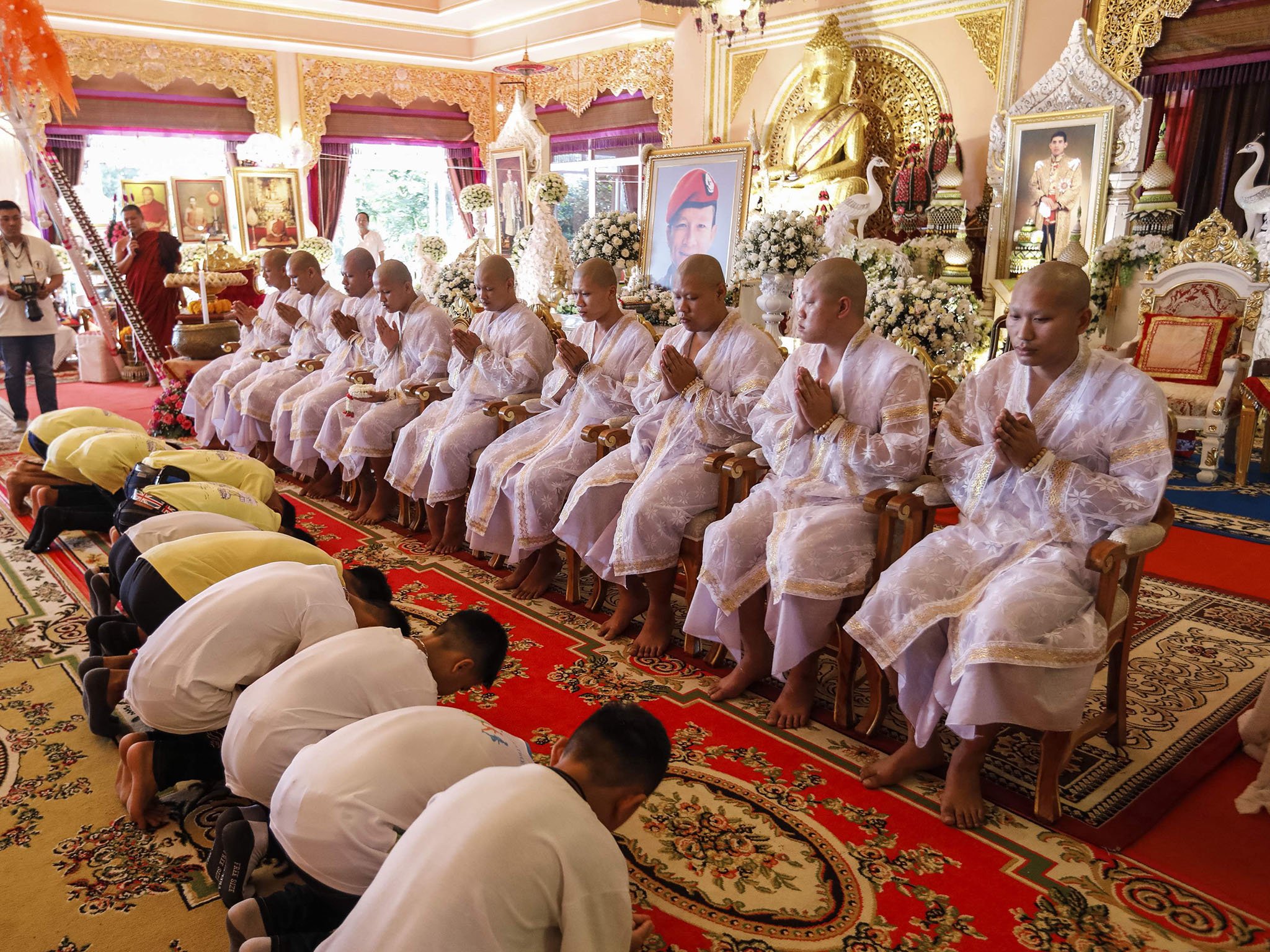 Thai cave boys pray for protection from misfortunes on visit to Buddhist temple