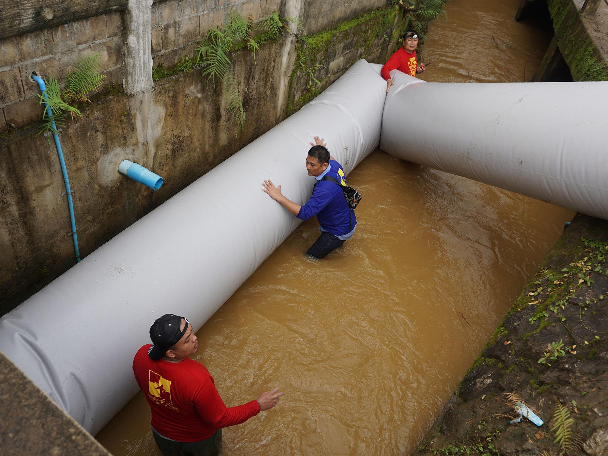 Thai cave rescue: Giant plastic tube device being tested at site in case divers fail in effort to rescue trapped boys