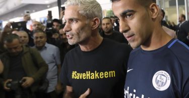 Refugee footballer returns to hero’s welcome in Australia after Thailand sets him free