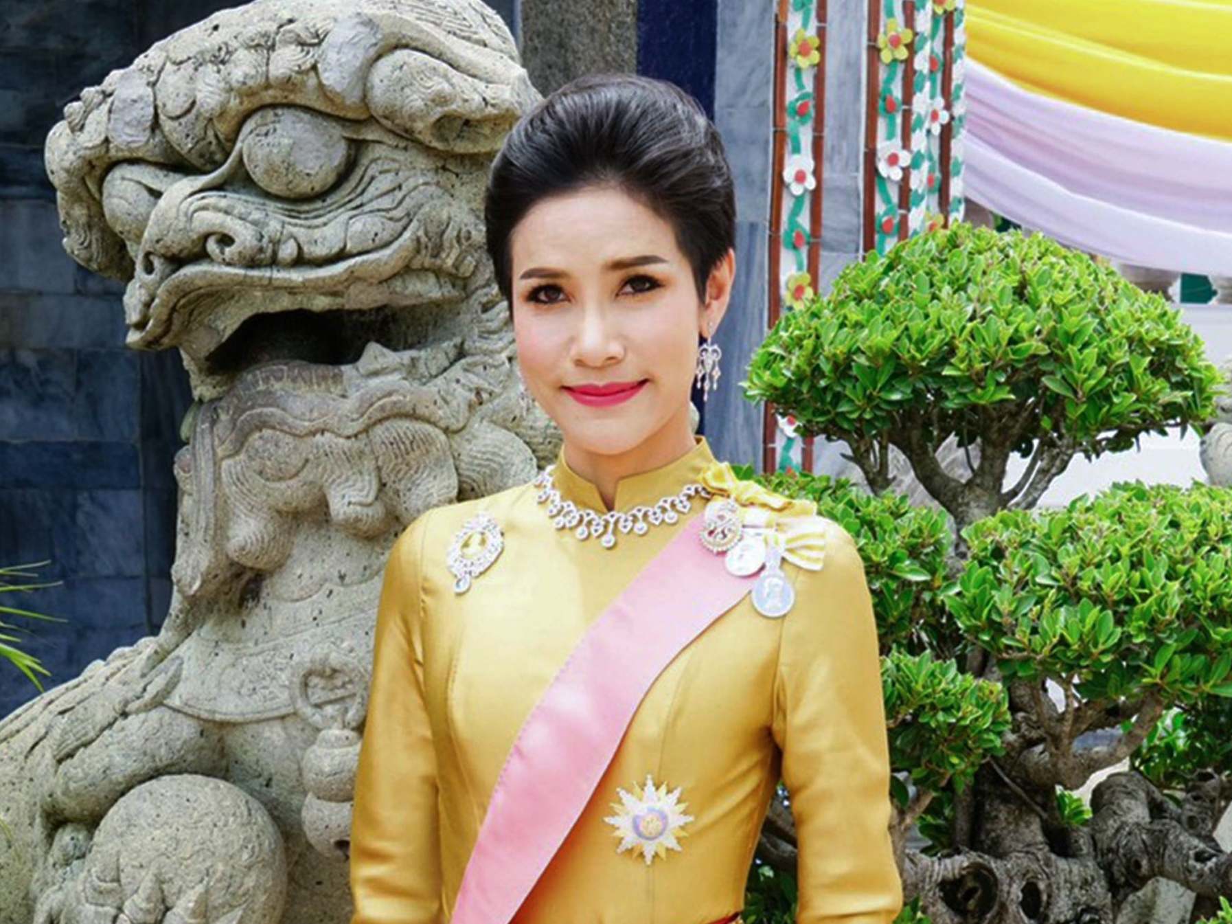 Thai king strips royal consort of her titles and military rank for ‘disloyalty’
