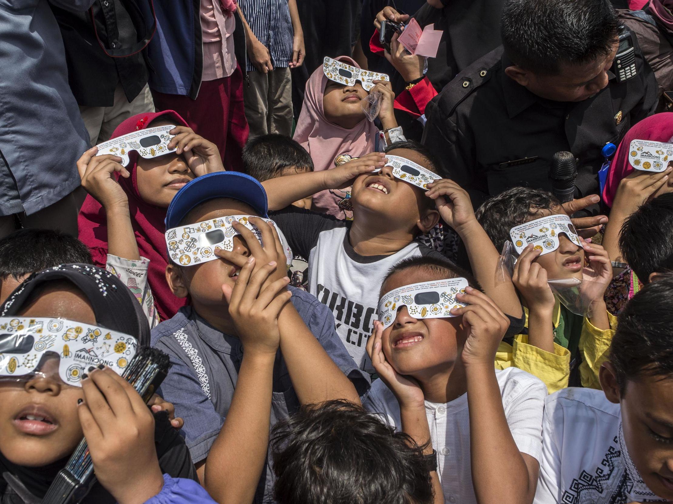 Thousands gather for stunning ‘ring of fire’ eclipse