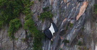 Parachute accident leaves man dangling from cliff