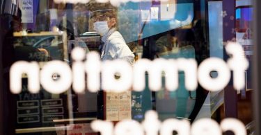 The Latest: UK advises against foreign travel amid virus