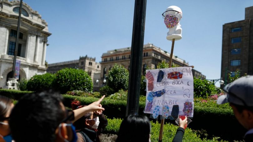 Mexico’s busy streetscape slows, but doesn’t stop for virus