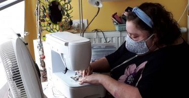 Belgian with 20% lung capacity starts home mask sewing army