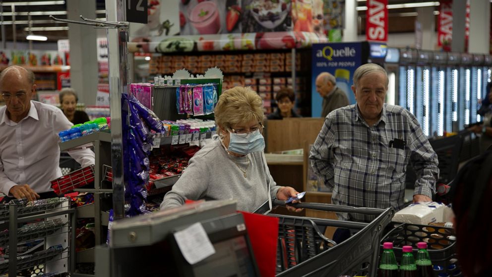 Governments grapple with virus border closures, lockdowns
