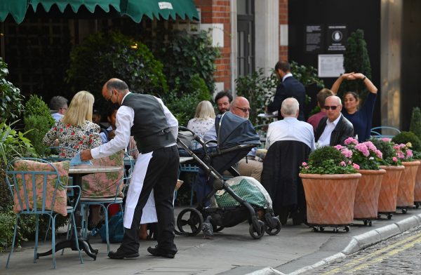 Britain to impose new virus curbs as WHO issues grim warning