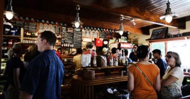 England to require earlier 10 p.m. closing time for pubs, eateries after virus spike