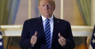 Trump, still infectious, back at White House