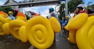 Humble rubber duckie stands tall as protector of Thai demonstrators