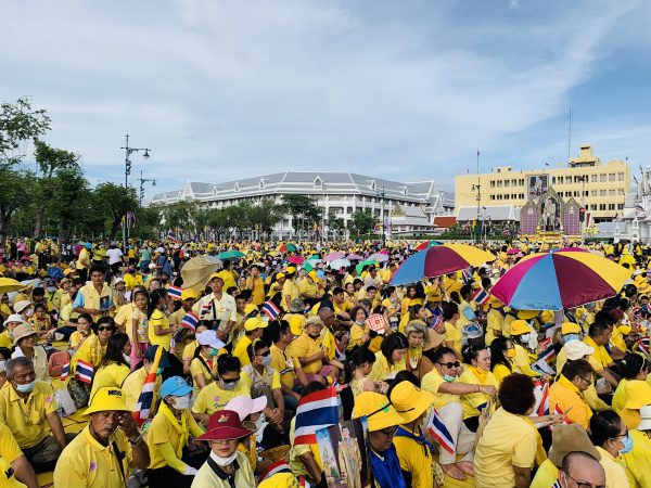 Crowds in yellow shirts show up to greet Thailand’s King and Queen at the Grand Palace