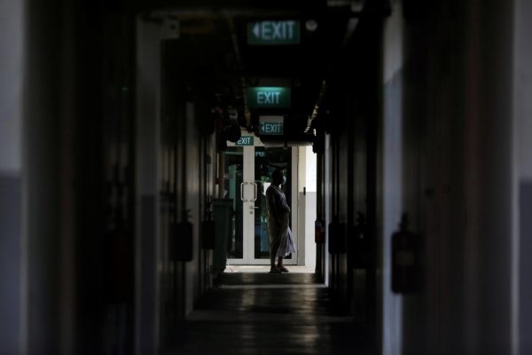 Half of Singapore’s migrant workers in dormitories have COVID-19