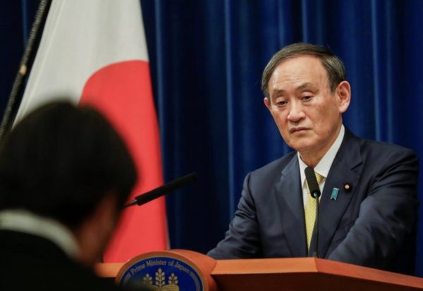 Japan PM to decide on tourism campaign as approval rating plummets over virus