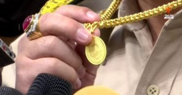 Sira Jenjakha and his gold medallion featuring General Prawit’s image