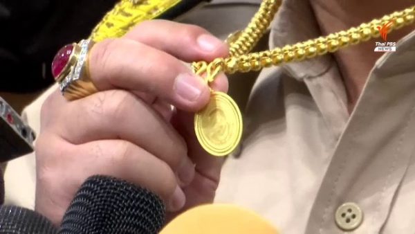 Sira Jenjakha and his gold medallion featuring General Prawit’s image