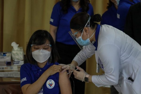 ‘Light’ after darkness as Philippines Covid-19 vaccinations begin