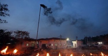 India’s crematoriums overwhelmed as virus ‘swallows people’