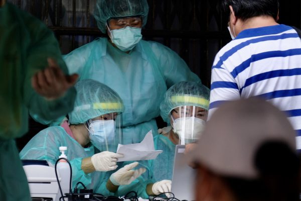 Taiwan raises coronavirus alert level after spike in infections