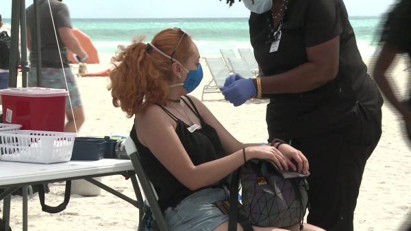 ‘Vaccine tourists’ fly from abroad for injections on US beach