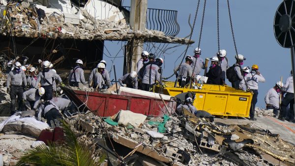 Crews spend 5th day atop shaky pile of collapsed concrete