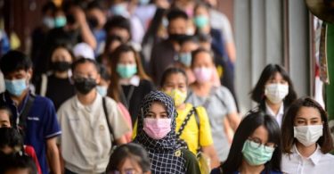 Wearing two face masks may be needed as Thailand logs 5,420 new COVID-19 cases Tuesday