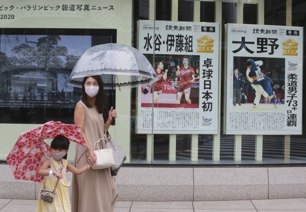 Tokyo reports record virus cases days after Olympics begin