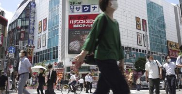 Officials in Tokyo alarmed as cases hit record highs
