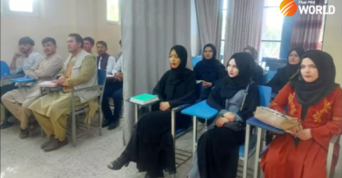 A curtain divides male, female students as Afghan universities reopen